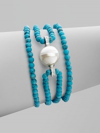 A glistening baroque pearl, surrounded by strands of turquoise beads, is accented by sparkling cubic zirconia. 14mm baroque pearl Cubic zirconia Sterling silver Length, about 7½ Lobster clasp Made in Spain 