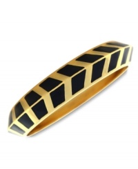 A pattern with panache. Vince Camuto's bangle bracelet is crafted from gold-tone mixed metal and black enamel with a bold chevron design for a stylish touch. Approximate diameter: 3-1/2 inches.