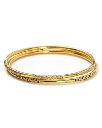 Melinda Maria's set of three gold bangles are a perfect complement to breezy bohemian looks. Wear the stack solo, or copy the cool-girls with a gilded wristful.