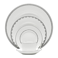 Vera Wang introduces Flirt fine bone china dinnerware. This platinum banded pattern features a modern scallop lace motif and a contemporary take on traditional lace work. Decoration on the inner verge of the accent plate, bread and butter and tea saucer adds a flirtatious touch of whimsy.