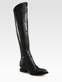 A sleek asymmetrical shaft and inverted heel upgrade this urban-ready leather design. Stacked heel, 1½ (40mm)Shaft, 21Leg circumference, 14½Leather upperBack zipLeather lining and solePadded insoleImported