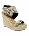 That's a wrap. There's nothing ordinary about the Kabuki sandals by Rebels. With a snake-print ankle wrap and espadrille wedge heel, they're sexy perfection.