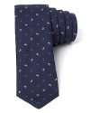 A modern, skinny width tie from Paul Smith keeps its eye on the classics with a vintage-inspired floral print.