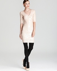 A symphony of sparkling sequins embellish this shapely BCBGMAXAZRIA dress that falls above the knee and features a sensual V neckline--a hint of stretch for extra comfort is the cherry on top.