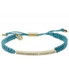 All that sparkles. Michael Kors' pretty macrame bracelet features woven turquoise cotton cord with a gold tone mixed metal bar, accented with glistening pave glass stones. Clasp, setting and logo charms crafted in gold tone mixed metal. Approximate diameter: 2 to 2-3/4 inches. Bracelet adjusts to fit wrist.