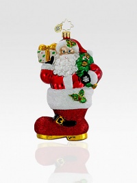 Hand-painted and glitter-dusted, an artfully crafted Santa of European glass rests inside an oversized boot. Hand-blownHand-painted5½ tallMade in Poland