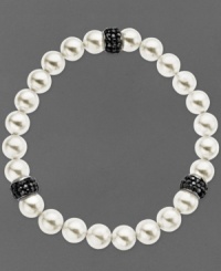 Slip a little elegance over your wrist. Kaleidoscope's pretty bracelet features a mix of cultured freshwater pearls (8 mm) and sparkling stations made from black crystals with Swarovski Elements. Bracelet stretches to fit wrist. Approximate length: 7-1/2 inches.