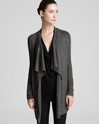 Ultra-sumptuous and soft to the touch, this HELMUT draped cardigan sweater layers over minimalist staples for an infusion of luxury and decadence into your fall wardrobe.