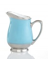 Get away from ordinary dining with dreamy Lauderdale dinnerware by Cru. Shimmering platinum dots and bands contrast swaths of sea blue on this fuss-free, dishwasher-safe oval creamer inspired by a favorite Floridian retreat.