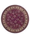 A round rug that is ideal for the center of rooms. Inspired by classic Persian art and culture, this rug features an arresting color palette of burnt red and neutral hues and a beautiful, curvilinear floral pattern. Easy-care polypropylene ensures durability.