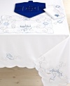 Dreidel you shall play. Keep spirits high for eight days and beyond with a festive Hanukkah table runner. An embroidered menorah and dreidel, plus delicate scalloped edges create a fresh backdrop for ancient traditions.