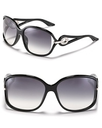 Sunglasses with style. Oversized frames with open temples and circular crystal accents from Dior.