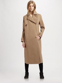 Modernized by an asymmetrical zipper, this military-inspired trenchcoat has notched lapels, slash pockets and a back vent for mobility. Notched lapelsButton frontAsymmetrical zipperLong sleeves with buttoned cuffsSlash pocketsButtoned back belt; back ventAbout 36 from shoulder to hemCottonDry cleanMade in ItalyModel shown is 5'10 (177cm) wearing US size 2.