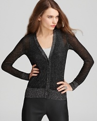 Classic prep meets rocker chic as a splash of shimmer elevates the essential Tory Burch cardigan.