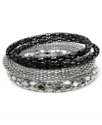 Stackable fun, by GUESS. These eye-catching bangle bracelets feature exotic textures and black jet plating for easy cool. Crafted in imitation rhodium and sprayed jet mixed metal. Approximate diameter: 2-1/2 inches.