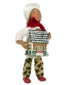 The handcrafted Kindle Icing figurine presents one of her biggest accomplishments in the kitchen, delivering a picturesque gingerbread house with snow-capped evergreens and peppermint swirls. With gingerbread men pants to match.