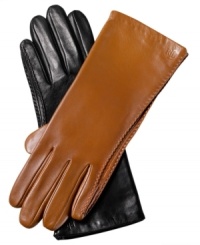 A classic always stays in style. These sumptuous leather gloves from Lauren by Ralf Lauren are effortlessly chic and accented with fine stitching at the seams and logo-embossed detailing at the cuff.