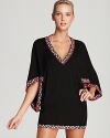 Elevate your poolside style in a Trina Turk coverup that boasts bold trim and elegant kimono sleeves.