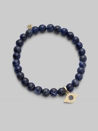 The evil eye, rendered in diamonds and sapphires, makes a graceful amulet, thought to offer protection as it hangs from a stretchy strand of sodalite beads. Diamonds, 0.07 tcw Sapphires Sodalite 14k yellow gold Unstretched diameter, about 2 Imported