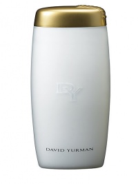 Envelops your skin in a sumptuous veil of softness, leaving it delicately fragranced with the intertwining notes of exotic woods, patchouli, and waterlily. Packaged in a translucent white elongated bottle with a gold flip top cap, accented with the David Yurman signature cable motif. 6.8 oz. 