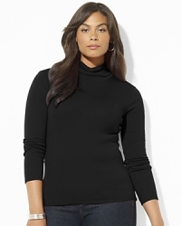 A classic long-sleeved turtleneck is crafted in soft cotton for easy style and comfort.