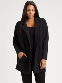 Whether worn over a sleek or relaxed-fit top, this boiled merino wool coat is sure to make a stylish first impression. Notched collarDolman sleevesWelt pocketsAbout 32 from shoulder to hemBody: merino woolSleeves: merino wool/nylon/spandexDry cleanImported