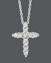 Inspirational style for timeless shine. Express your faith in B. Brilliant's sparkling cross pendant. Crafted in sterling silver with round-cut cubic zirconias (1/3 ct. t.w.). Approximate length: 18 inches. Approximate drop: 5/8 inch.