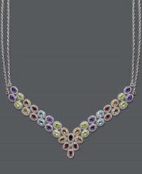 Elevate your look with this fine touch of luxury. This stunning multi-stone v-shaped necklace highlights oval -cut blue topaz (4-1/2 ct. t.w.), peridot (4 ct. t.w.), citrine (3-1/2 ct. t.w.), amethyst (3-1/2 ct. t.w.) and garnet (2-1/2 ct. t.w.). Set in sterling silver. Approximate length: 18 inches. Approximate drop width: 3 inches.