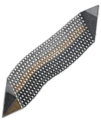 Painted color adds an artistic quality to this industrious bracelet from GUESS. The silver tone nine-row design features hematite and gold tone accents. Finished with a magnetic closure. Crafted in silver tone mixed metal. Approximate length: 7-1/2 inches.