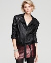 The classic motorcycle bomber redefined, this Alice + Olivia leather jacket is structured for a more feminine look with a tie-waist in a chic, cropped silhouette.