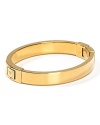 A subtle touch of shine, MICHAEL Michael Kors' gold bangle defines versatile. Wear the shapely hinged style to add a silvery polish to any outfit.