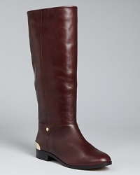 These riding boots are emboldened with golden trim, ready for stepping out stylishly 24/7; from Cynthia Vincent.