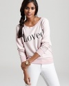 This slouchy-cool WILDFOX sweatshirt shows its adoration for you with the word Loved.