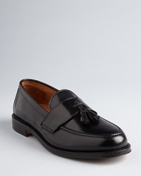 A pair of tassels fronts this traditional pair of loafers crafted in exceptional Italian leather for classic appeal.