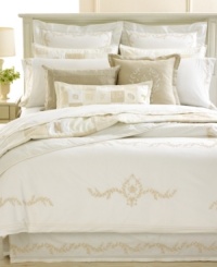 Relax in simply luxury with the hand-crafted Trousseau Crest quilt from Martha Stewart Collection. Each unique square features intricate embroidery and embellishments for a new look of traditional charm. (Clearance)