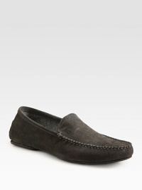 Sporty suede slip-on with stitch detail and an embossed logo.Suede upperRubber soleImported