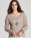 Shift into neutral with this breezy Free People sweater, classically cabled for fall, in a soft-touch wool blend.