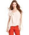 A bow-tie and flowy A-line shape makes this RACHEL Rachel Roy blouse an oh-so feminine topper over the season's skinny jeans!