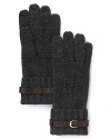 A leather buckle detail and ribbing at the wrist give these warm gloves from Portolano a memorable touch.