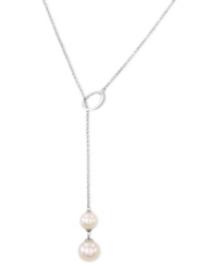 Simply elegant. This necklace from Majorica is crafted from sterling silver with organic man-made pearls (10/12 mm) adding a classic touch for the pendant. Approximate length: 20 inches. Approximate drop: 2-1/2 inches.