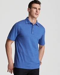 Subtle stripes decorate a soft cotton polo from Michael Kors.