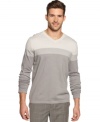 Layer on the style with this sharp striped v-neck sweater from Alfani BLACK.