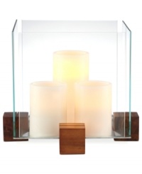 Sheer brilliance. Three candles contained within a block of glass and raised on blocks of wood add modern intrigue to your patio or picnic table. From Dansk.