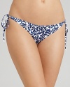 This delicate and feminine floral print bikini from DIANE von FURSTENBERG is perfect for the weekends at the lake or the country club pool. Add gold-rimmed aviators for a preppy, polished look.