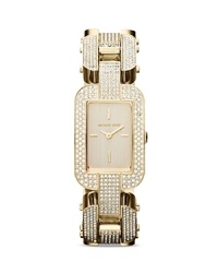 Gorgeous clear stones define the sleek bracelet of a glamorous Michael Kors three-hand watch, finished in glossy gold plated metal.