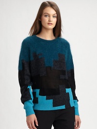 Mesh paneling and a graphic, colorblocked pattern modernize this plush sweater. RoundneckLong sleevesRibbed cuffs and hem37% wool/30% viscose/23% angora/10% polyamideDry cleanImportedModel shown is 5'10 (177cm) wearing US size Small.