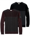 This pieced and color-blocked sweater from DKNY Jeans offers a modern look and a warm cozy feel.