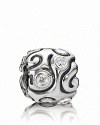 Swirling lines and bezel-set cubic zirconia stones make this sterling silver PANDORA charm bewitching.