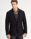 Single-breasted blazer displays a rich, textured appearance, tailored in superior virgin wool with a simple check pattern finish.Button-frontNotch lapelChest, waist patch pocketsSide ventsFully linedWoolDry cleanImported