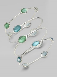 From the Silver Wonderland Collection. Faceted ovals of quartz in soft denim blue are backed by discs of mother-of-pearl and set in a graceful bangle of hammered sterling silver. Quartz and mother-of-pearl Sterling silver Diameter, about 2¾ ImportedPlease note: Bracelets sold separately. 